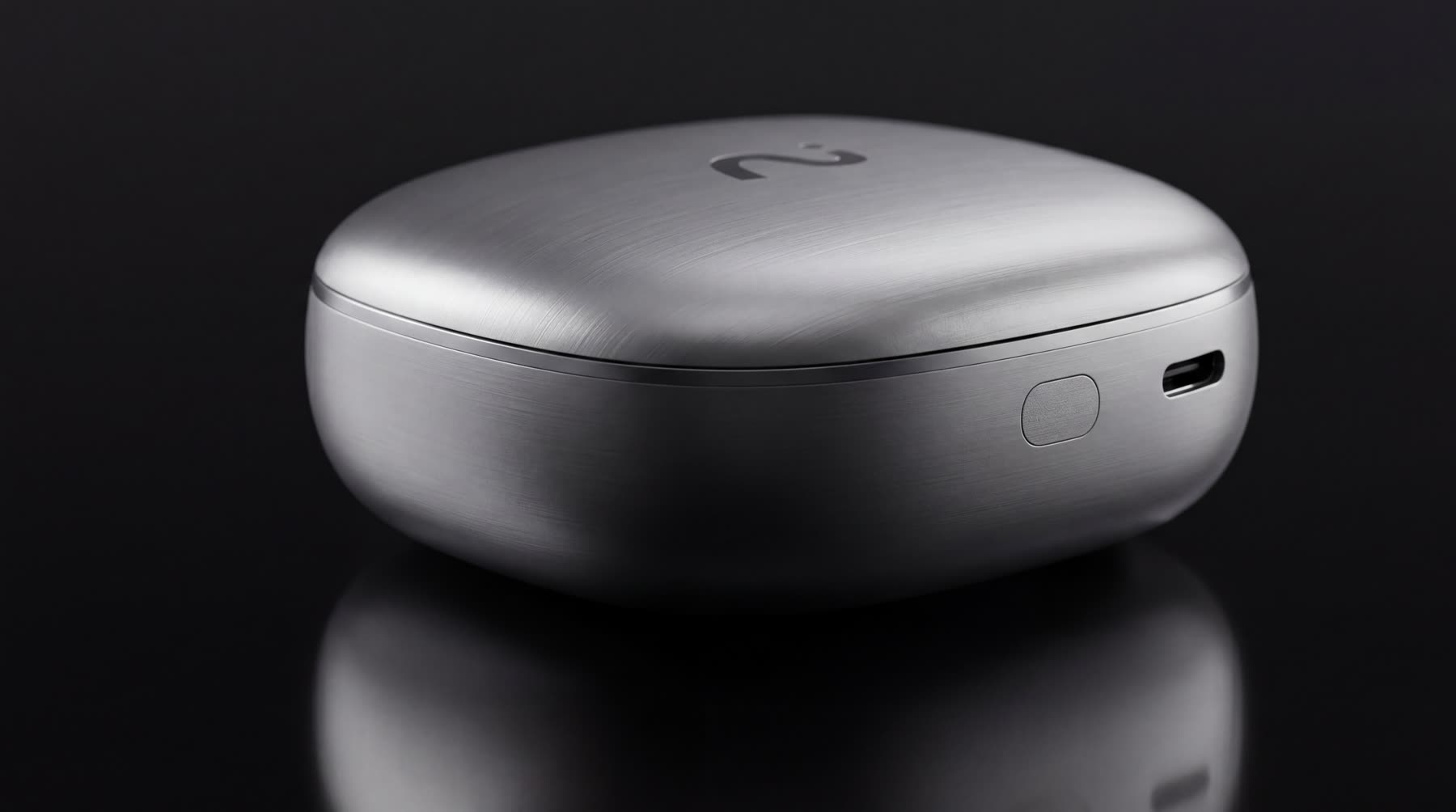 Metallic iFLYBUDS Pro 3 charging case on a dark surface